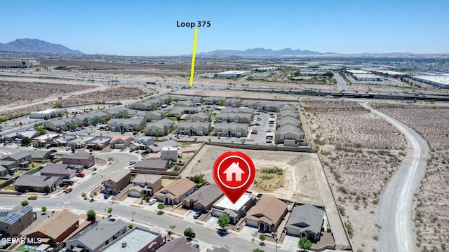 bird's eye view with a residential view and a mountain view