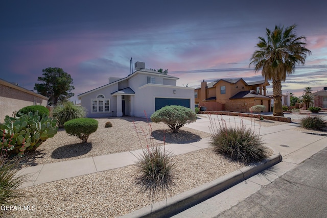 mediterranean / spanish-style house featuring driveway and stucco siding