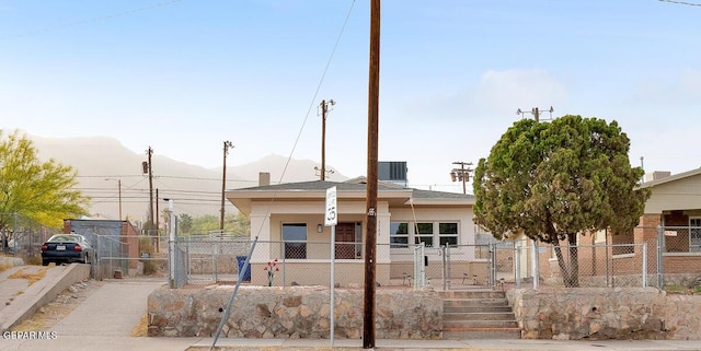 2723 Grant Ave, El Paso, TX 79930 - view of front of property with a fenced front yard, a gate, and stucco siding