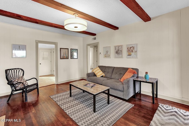 2723 Grant Ave, El Paso, TX 79930 - living area with beamed ceiling, dark wood-style floors, and baseboards