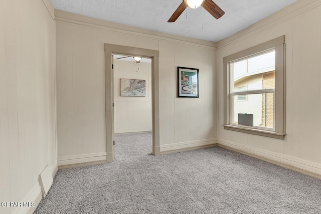 2723 Grant Ave, El Paso, TX 79930 - spare room with a ceiling fan, carpet flooring, a textured ceiling, and baseboards
