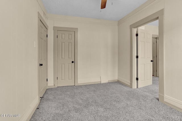 2723 Grant Ave, El Paso, TX 79930 - unfurnished bedroom with carpet floors, ceiling fan, and a textured ceiling