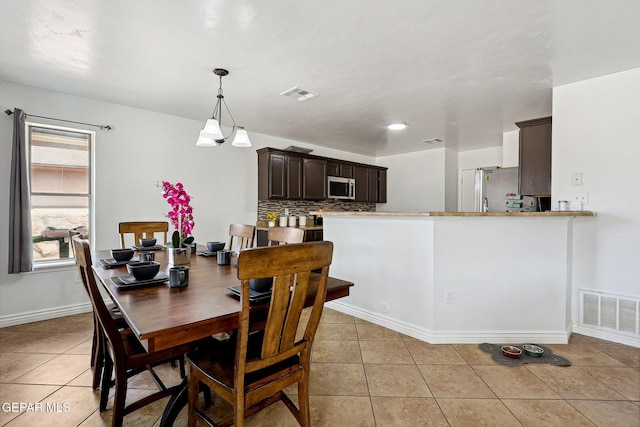 2709 Granite Rock Pl, El Paso, TX 79938 - dining room featuring light tile patterned floors, baseboards, and visible vents