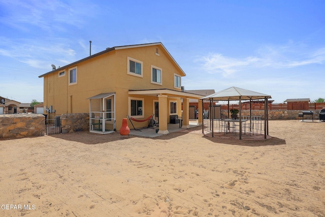 2709 Granite Rock Pl, El Paso, TX 79938 - rear view of house featuring a gazebo, fence, a patio area, and stucco siding