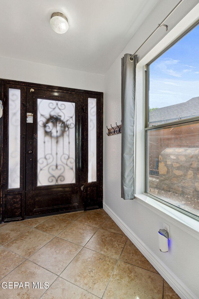 2709 Granite Rock Pl, El Paso, TX 79938 - entryway with baseboards and light tile patterned flooring