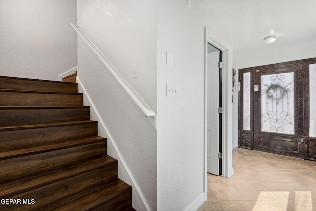 2709 Granite Rock Pl, El Paso, TX 79938 - entryway with stairs, a textured wall, and light tile patterned floors