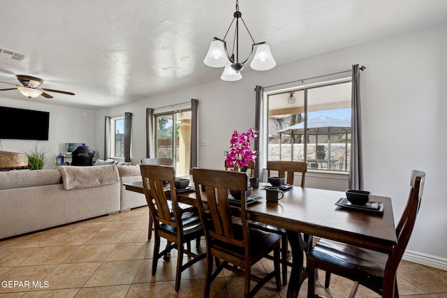 2709 Granite Rock Pl, El Paso, TX 79938 - dining space with visible vents, light tile patterned floors, and ceiling fan with notable chandelier