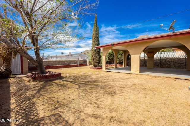 view of yard with fence and a patio area