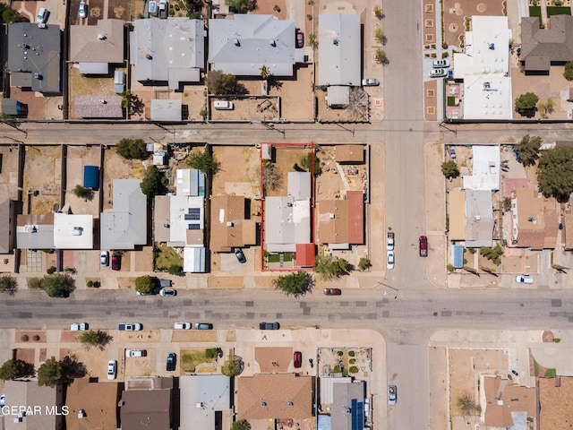birds eye view of property with a residential view