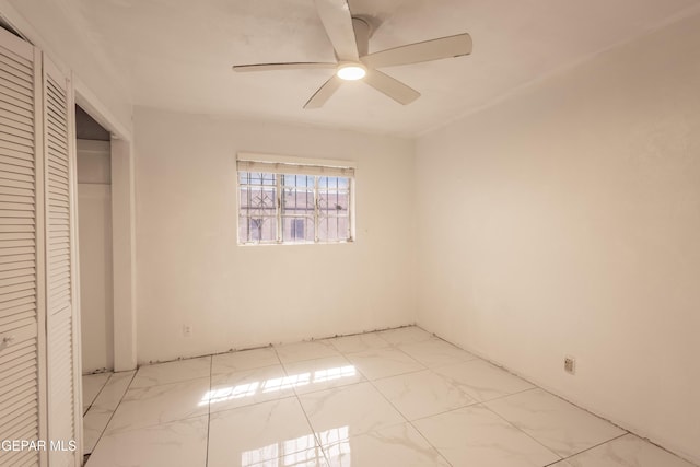 unfurnished bedroom featuring a closet and ceiling fan