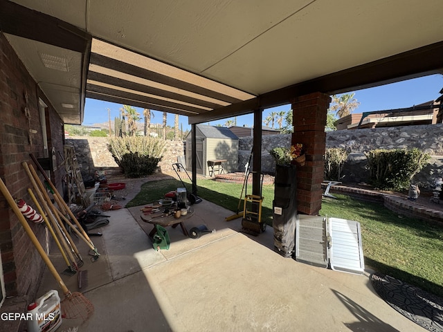 view of patio with a storage shed and an outdoor structure
