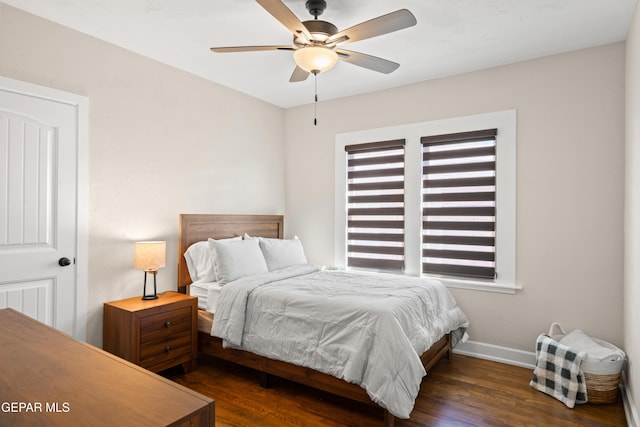 bedroom with baseboards, a ceiling fan, and wood finished floors