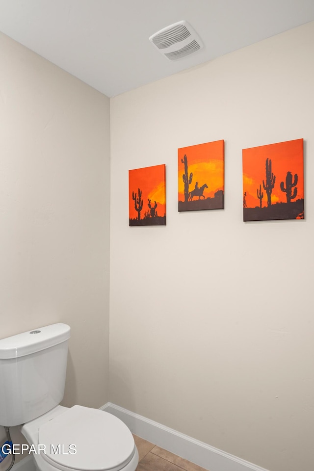 bathroom featuring baseboards, tile patterned floors, toilet, and visible vents