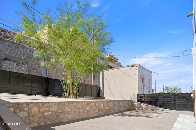 view of property exterior with fence