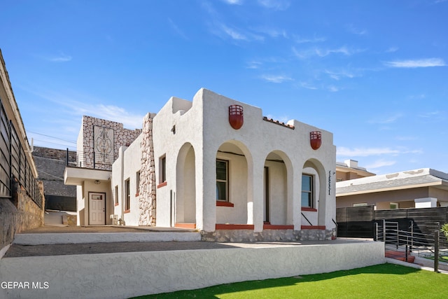 view of front of house featuring stucco siding
