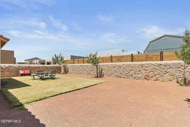 view of yard with a fenced backyard