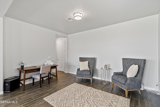 office area featuring baseboards, wood finished floors, and visible vents