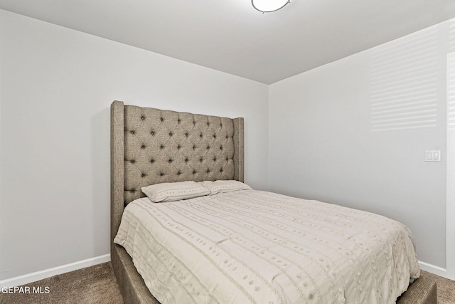 bedroom with carpet floors and baseboards