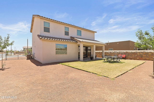 back of house with fence, central AC, stucco siding, a patio area, and a tile roof