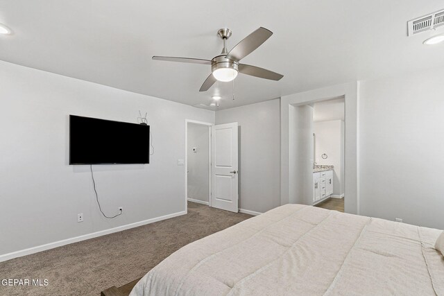 bedroom with connected bathroom, dark carpet, a ceiling fan, baseboards, and visible vents