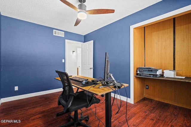 home office featuring wood finished floors, ceiling fan, and baseboards