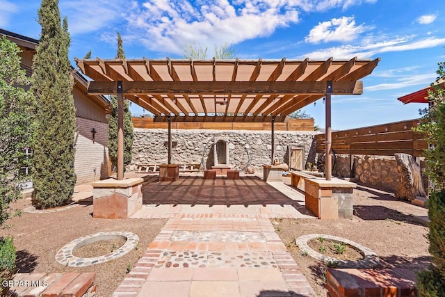 view of patio / terrace featuring a fenced backyard and a pergola