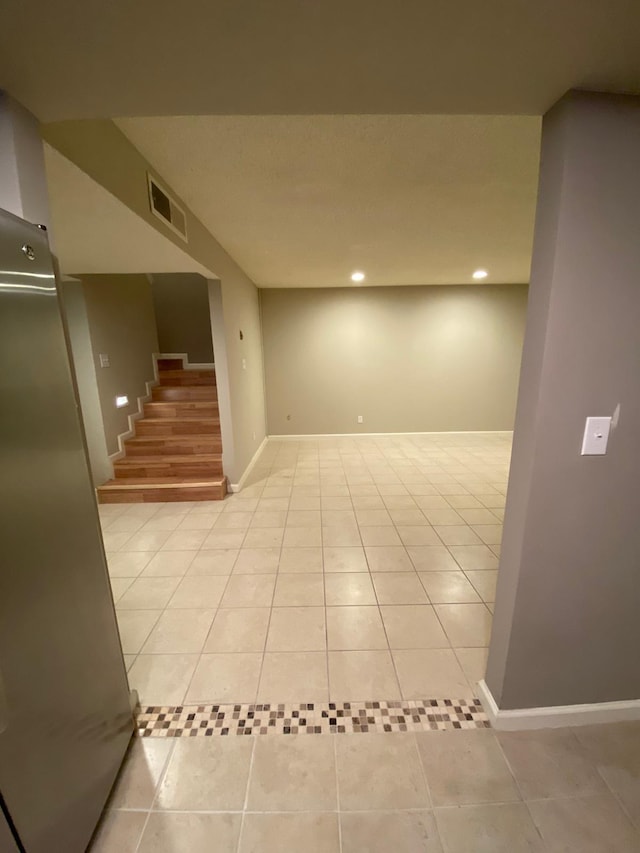 interior space with stairs, recessed lighting, baseboards, light tile patterned floors, and visible vents