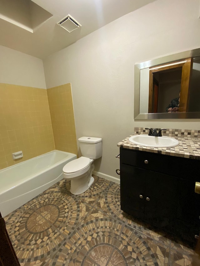 bathroom featuring visible vents, baseboards, toilet, and vanity