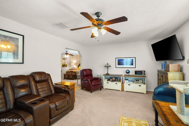 1829 Paseo Real Cir, El Paso, TX 79936 - living room with light carpet, a ceiling fan, a textured ceiling, and visible vents