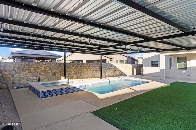 view of pool with a fenced in pool, an in ground hot tub, fence, and a patio area