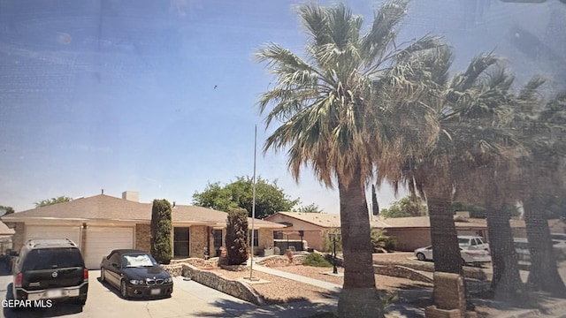 view of front of home with a garage and driveway