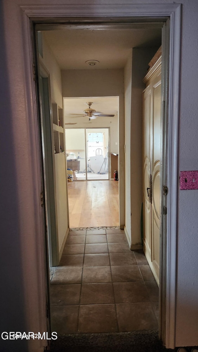 11325 Tom Ulozas Dr, El Paso, TX 79936 - hall featuring dark tile patterned flooring