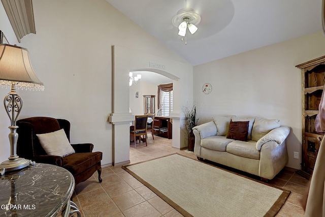living room featuring light tile patterned floors, arched walkways, ceiling fan, and high vaulted ceiling