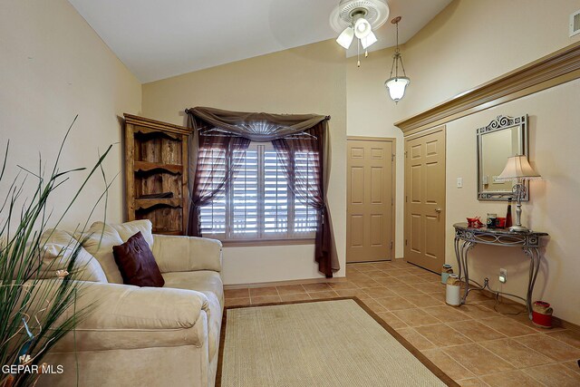 sitting room with tile patterned flooring, ceiling fan, high vaulted ceiling, and visible vents
