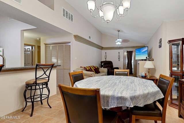 dining room with light tile patterned flooring, visible vents, lofted ceiling, and ceiling fan with notable chandelier