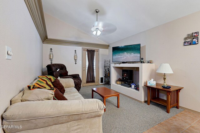 living area featuring baseboards, a ceiling fan, and lofted ceiling