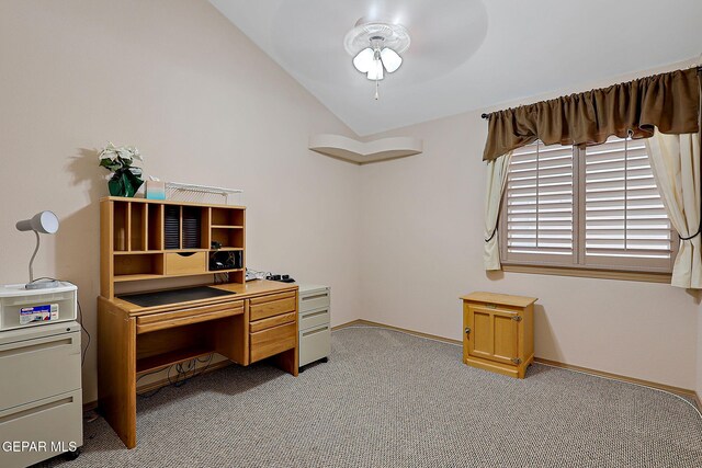 office area featuring carpet floors, baseboards, and vaulted ceiling