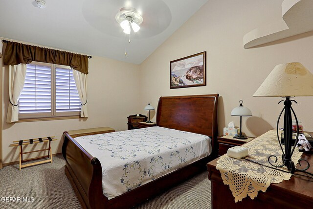 carpeted bedroom with baseboards, a ceiling fan, and vaulted ceiling