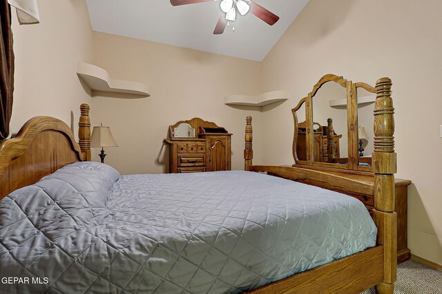 bedroom featuring ceiling fan, baseboards, and lofted ceiling