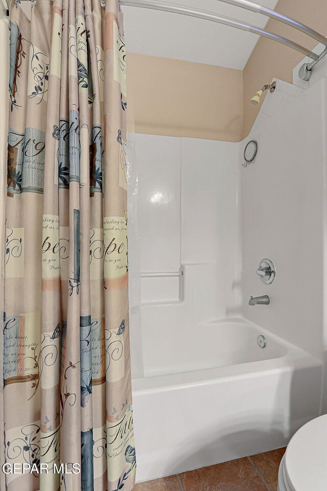 bathroom with shower / bath combination with curtain