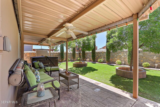 view of patio featuring a fenced backyard, a ceiling fan, and an outdoor living space