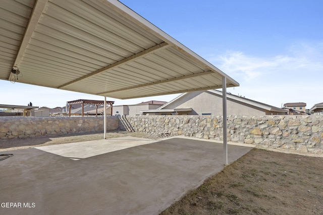 view of patio featuring fence
