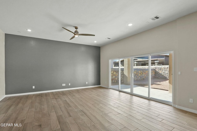 unfurnished room featuring ceiling fan, visible vents, wood finished floors, baseboards, and recessed lighting