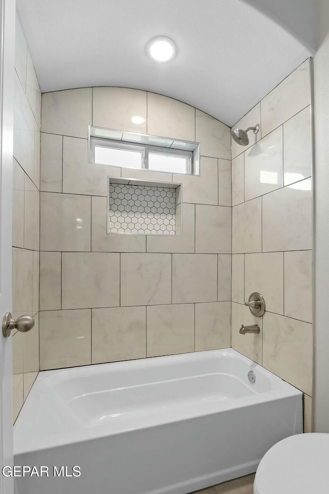 full bathroom featuring toilet and shower / bath combination