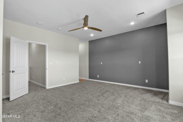 carpeted empty room featuring a ceiling fan, baseboards, visible vents, and recessed lighting