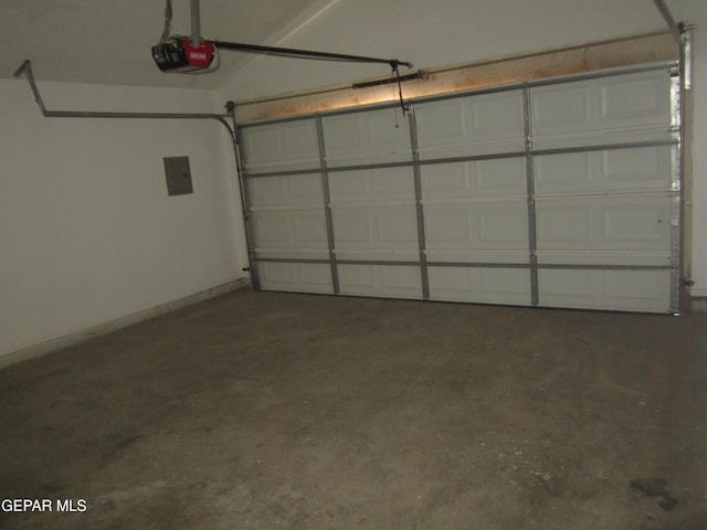 garage featuring a garage door opener and electric panel