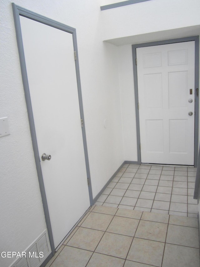 interior space with light tile patterned floors