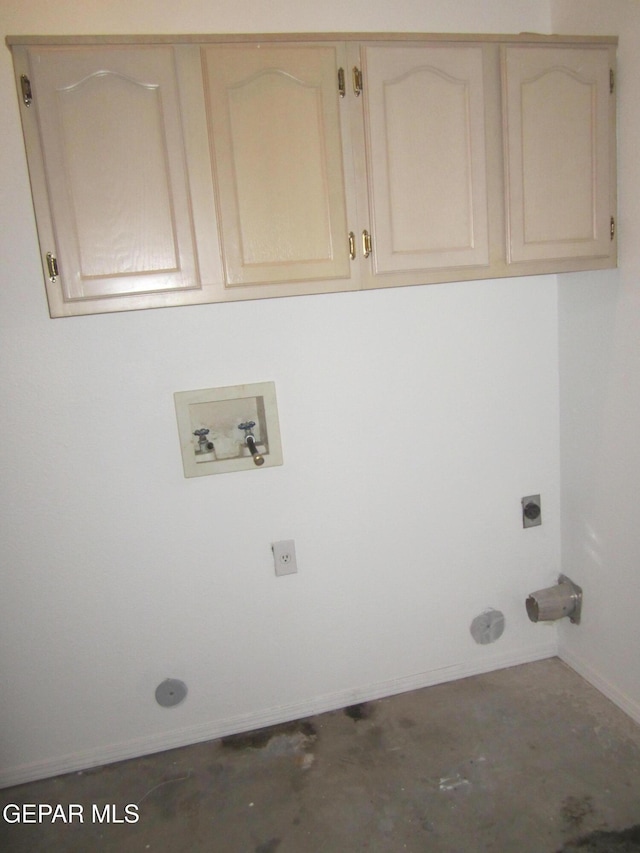 laundry area featuring baseboards, hookup for a washing machine, cabinet space, and hookup for an electric dryer
