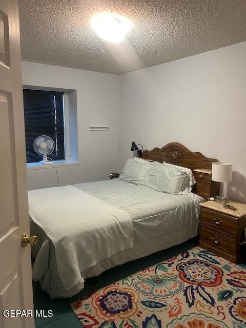 bedroom with a textured ceiling