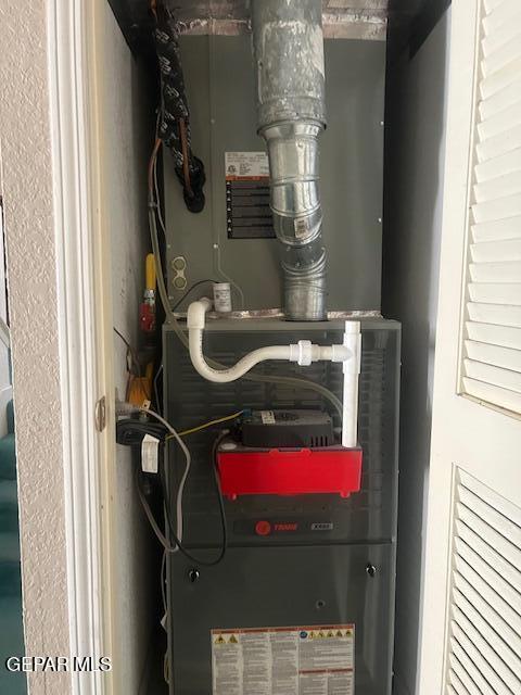 utility room with heating unit